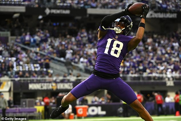 Justin Jefferson #18 of the Minnesota Vikings warms up before the NFC Wild Card playoff game against the New York Giants at US Bank Stadium