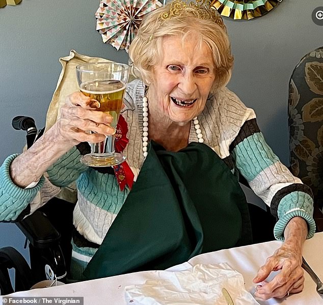 The World War II veteran marked the historic birthday with chocolate cake, crab cakes and beer, pictured