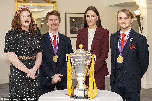 The Princess of Wales with Josie Hill (left), James Simpson and manager Tom Cold (right) with the team's trophy