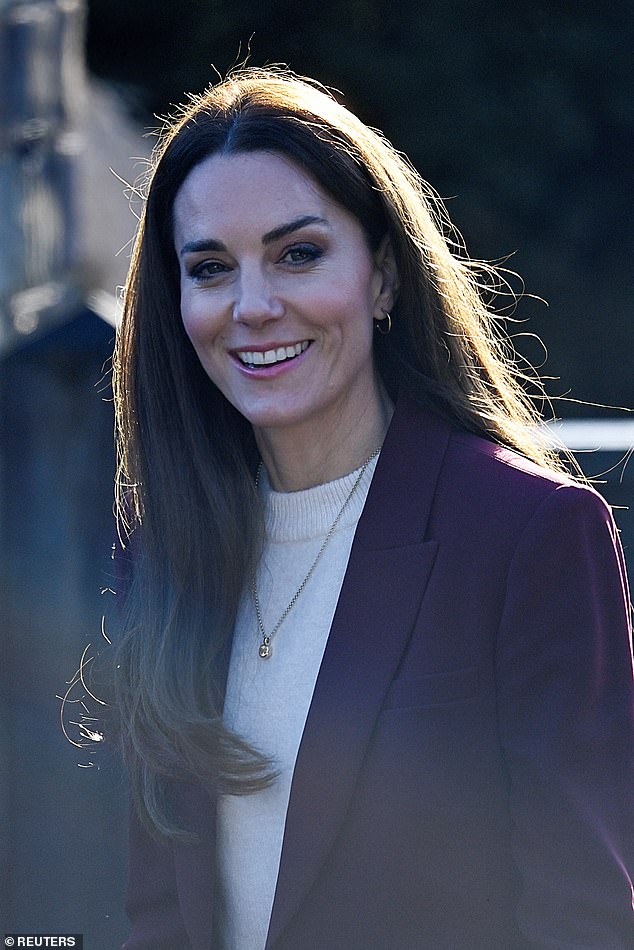 The mother-of-three styled her hair into a bob bob today and wore a minimal gold necklace over her chic white knit dress.