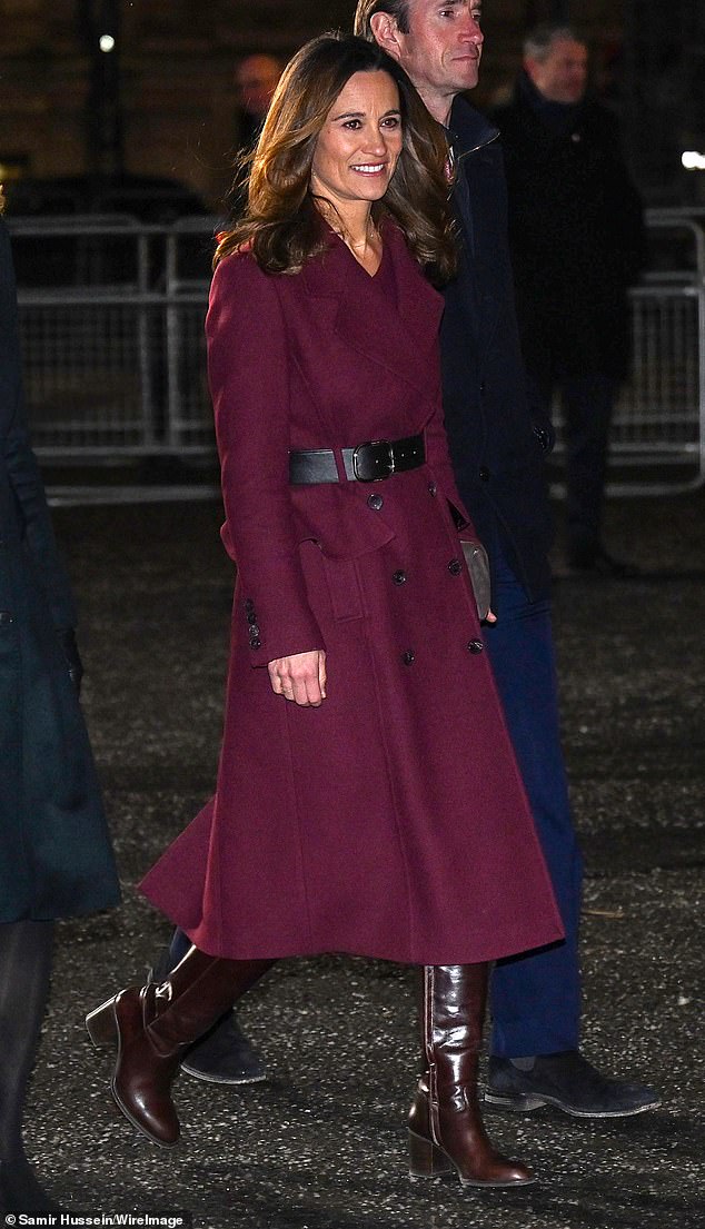 The Princess of Wales's sister Pippa Middleton (pictured) also jumped on the burgundy coat trend, pairing hers with a pair of brown boots.