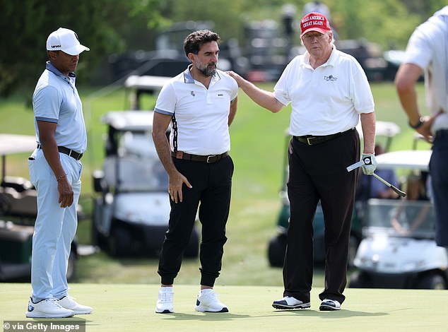 His Excellency Yasir Al Rumayyan (C) speaks with former US President Donald Trump (R) as Majed Al Sorour (L), CEO of the Saudi Golf Federation, looks on during the pro-am ahead of the LIV Golf Invitational - Bedminster at Trump National Bedminster Golf Club on July 28, 2022 in Bedminster, New Jersey