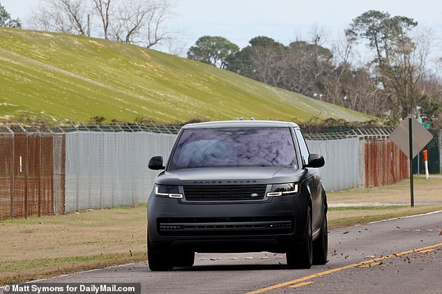 Later Tuesday morning, 650 miles away, Todd, 53, was photographed surrendering at the Federal Prison Camp in Pensacola, Florida, after arriving in a darkened Range Rover.