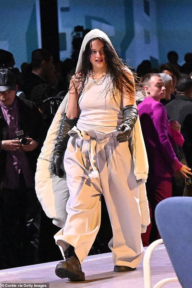 Grand entrance: Also seen on the catwalk was singer Rosalía, who cut a daring figure in an oversized white tracksuit.