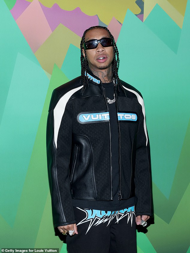 Ready to rock!  Wearing a matching leather look, Tyga also attended the fashion show.