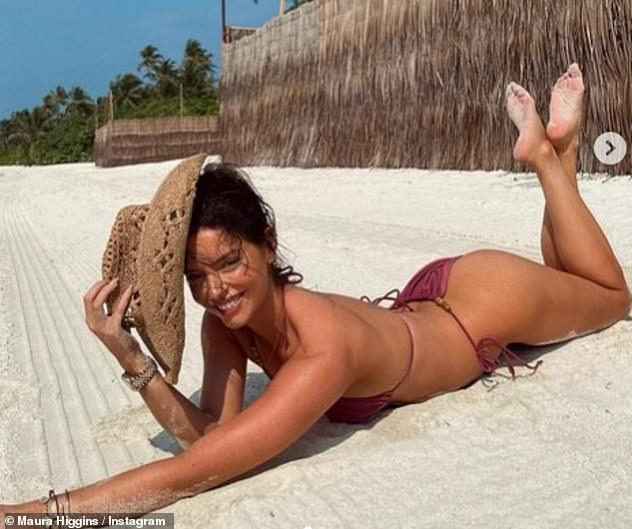 Fun in the sun: A skimpy bikini top put her at risk of a wardrobe malfunction, but it highlighted her tanned and toned physique