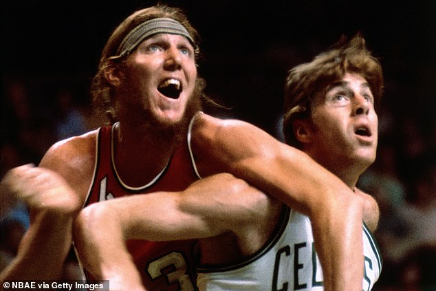 Bill Walton wrestles with Boston Celtics legend Dave Cowens for a rebound during a 1970 game