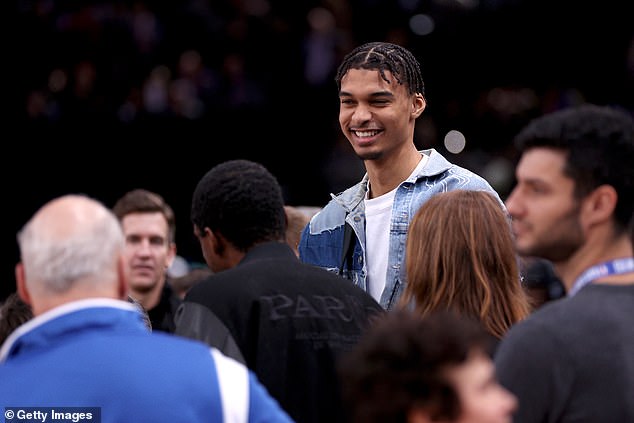 The French phenom was a man in demand as he was hounded for photos before the tip-off.