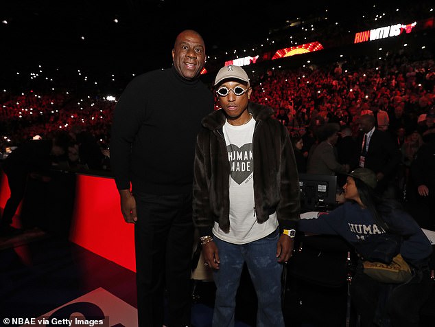 Lakers legend Magic Johnson (left) and singer Pharrell Williams (right) were also in attendance.