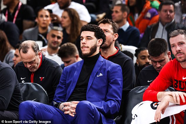 Injured Bulls guard Lonzo Ball donned navy blue to watch his teammates in action in Paris.