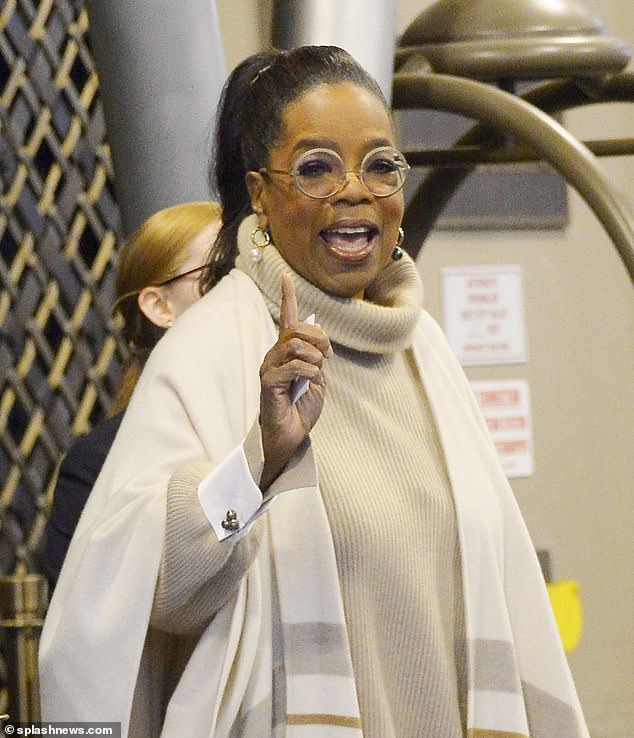 Fuel the private jet!  Oprah, who underwent double knee replacement surgery in 2021, wore round glasses over her made-up complexion and styled her black locks into a perky ponytail for her travels.