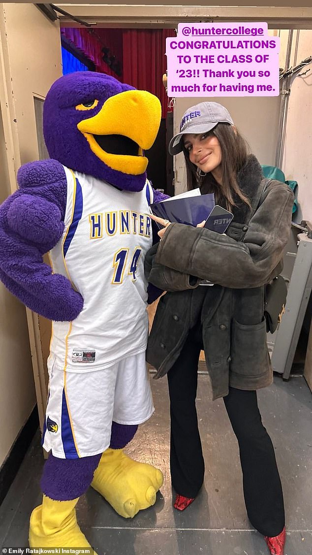 'Thank you so much for having me': Emily gave the graduates another shout out as she posed with the school's mascot