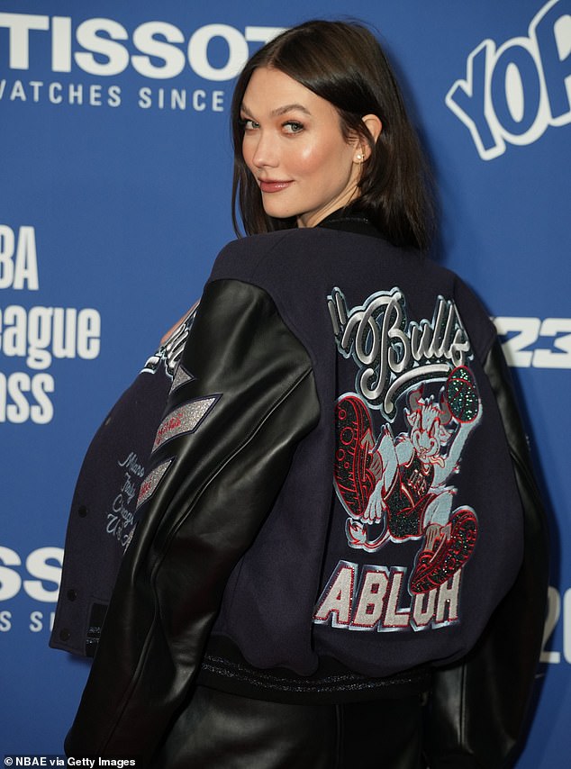 Rendering: The supermodel wore a corset and leather miniskirt under a varsity jacket dedicated to the late designer Virgil Abloh as she arrived for the game between the Chicago Bulls and Detroit Pistons.