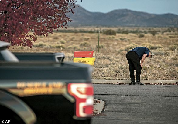 A devastated Baldwin is shown bowing in front of the Santa Fe County Sheriff's Office after speaking with investigators.