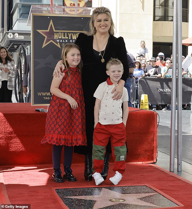 Keeping his family safe: Suspected stalkers are now prohibited from making any contact with the Idol star, or his two children -- daughter River, 8, and son, Remington, 6 -- and must keep an eye on less than 100 yards away;  pictured 2022