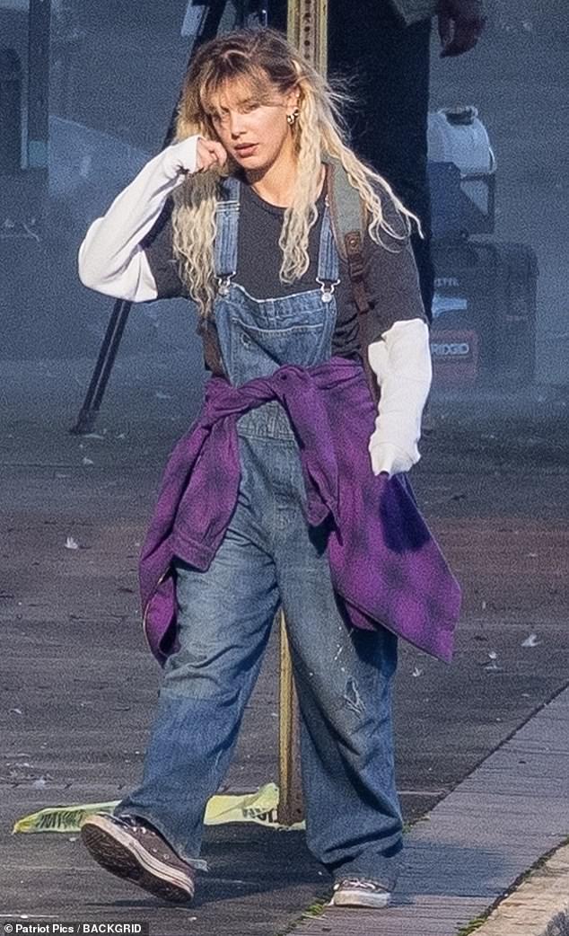 Spotted footage: The 18-year-old actress donned oversized denim overalls and sported long blonde hair while filming a scene for the upcoming sci-fi adventure film in Atlanta, Georgia.