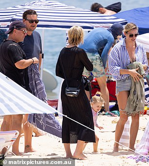 The couple seemed happy with Jasmine (right) and Karl Stefanovic (left) on the beach, but tensions escalated the next day.