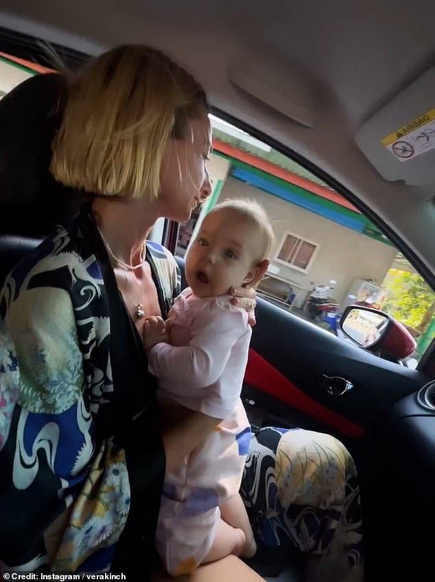 He then moves the camera to his passenger Anna Peretz, who is holding a baby on her lap.