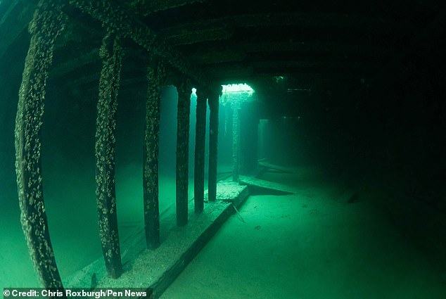 Chris Roxburgh documented the ship below the surface of Lake Charlevoix, Michigan, during a visit with his dive buddy, Lee Rosenberg.