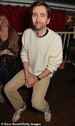 Casual: David cut a casual figure in a furry jumper