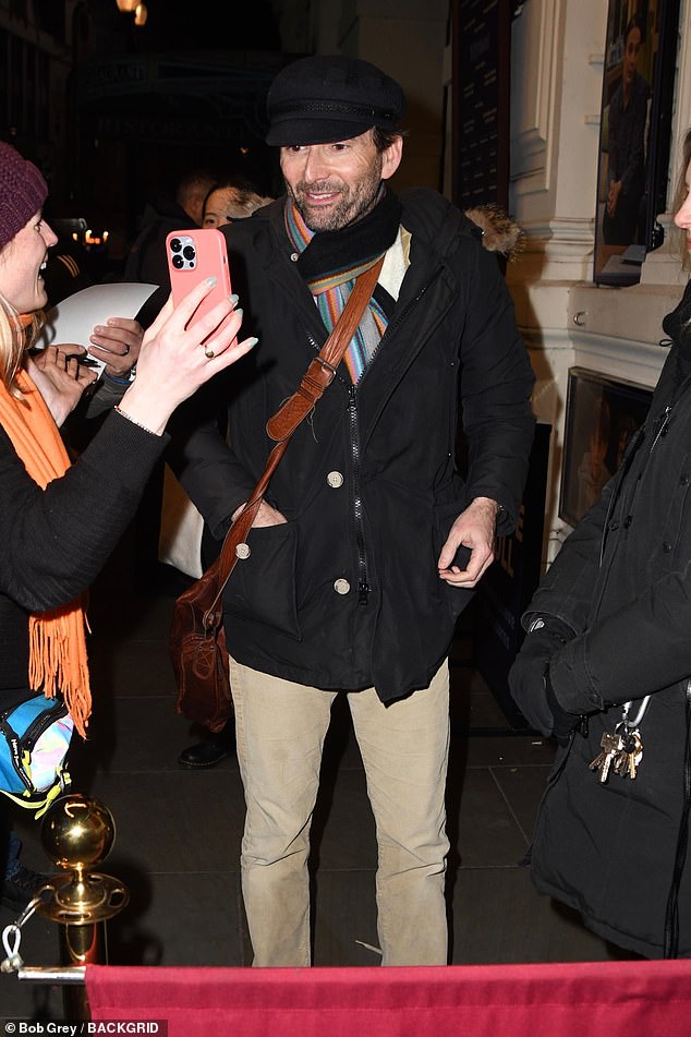 Cold weather: David then layered up as he left the fancy soiree