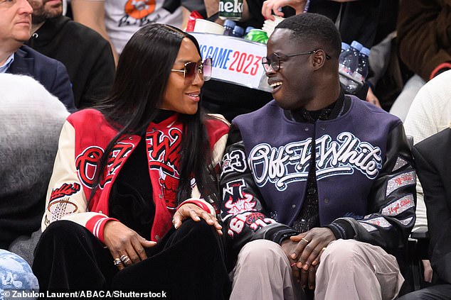 Stylish: In Paris for Fashion Week, Naomi sat courtside at the NBA basketball game between the Chicago Bulls and Detroit Pistons.