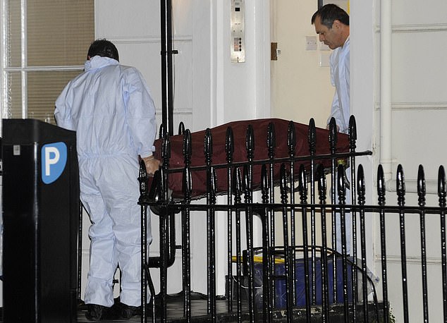 Forensic teams remove the body of Gareth Williams from his south London flat in 2010