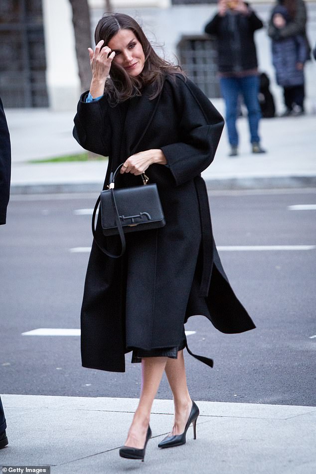 Opting for a tan smoky eye and nude lip, Letizia styled her shoulder-length hair for her engagement today.