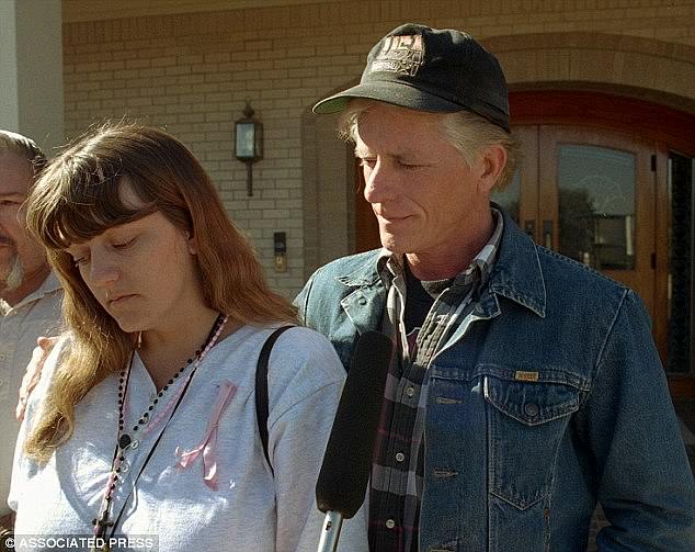 Amber's distraught mother and father, Richard Hagerman, appear outside the Arlington Funeral Home days after her body was found in 1996.