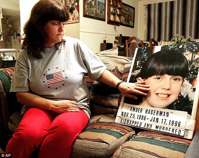 The plan was renamed Amber Alert (America's Missing: Broadcast Emergency Response) when it was first implemented in 1996. Williams is pictured holding a poster of her daughter.