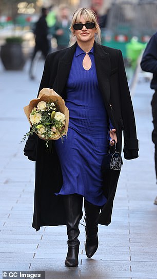 Looking good: Ashley accessorized with a pair of sunglasses and bundled up in a black coat