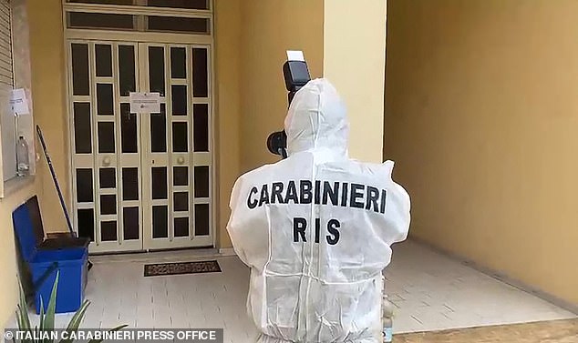 Pictured: A Carabinieri officer takes pictures of the house of Italy's top wanted mafia boss Matteo Messina Denaro in Palermo, in his native Sicily island, after 30 years on the run. Italian anti-mafia police caught the Sicilian godfather on January 16, 2023