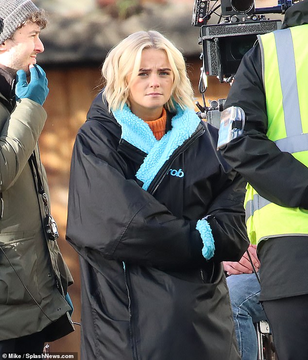 Action!  The former Coronation Street star battled the freezing January weather by wrapping up in a heavy puffer coat as he continued to work on the BBC show.