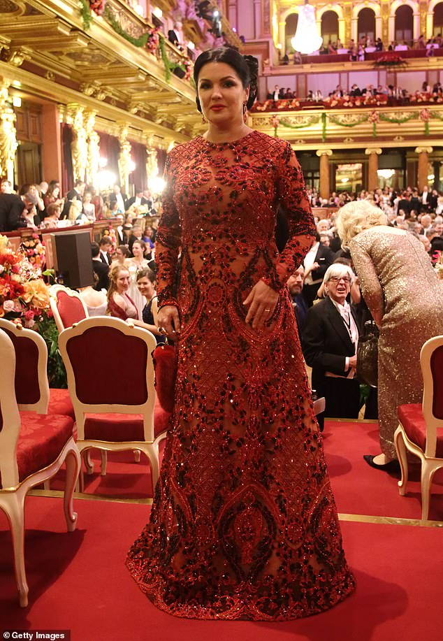 The Russian-Austrian opera singer's red dress was embellished with sparkling beads and sequins.