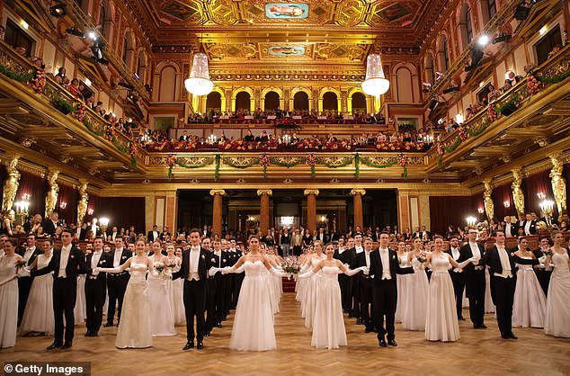 The debutantes sported stunning floor-length white gowns as they took to the ballroom dance floor.