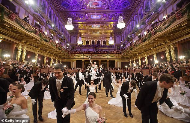 As the debutantes finished their routine, many knelt on the floor as a young dancer rose to his feet.