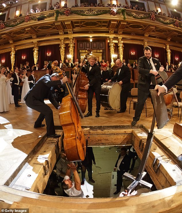 A crew stationed below the dance floor was on hand to take the heavy instruments as they were passed around.