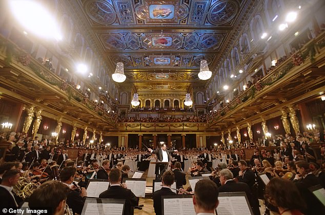 The orchestra performing during the opening ceremony of the 80th Vienna Philharmonic Ball under the direction of the conductor