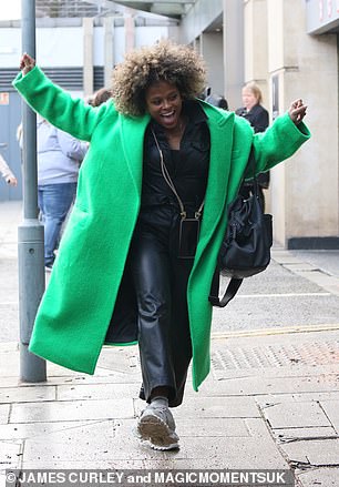 Turning heads: Fleur East turned heads in a bright green coat