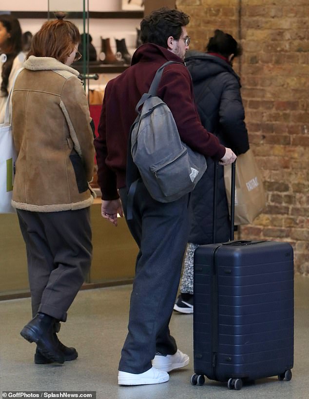 Together: The couple walked through the station together as they prepared to head home from their journey