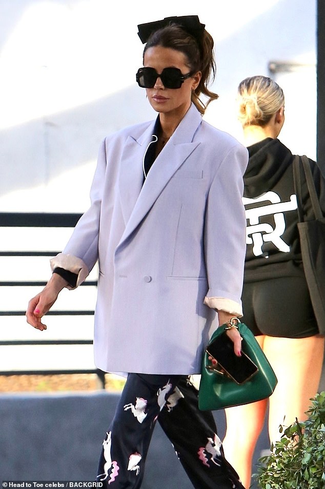 Stylish: The British actress, 49, looked amazing in an oversized lilac blazer over a navy silk pajama-style ensemble