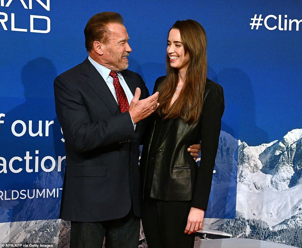 His girl: Daddy Arnie wore a blue blazer with dark blue jeans as he looked like the proudest dad in the world.