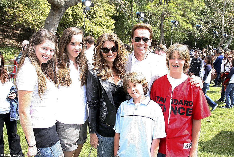 Early life: Schwarzenegger and his wife Shriver pose with their children Katherine, Christina, Patrick, and Christopher at a pre-release softball game with The Benchwarmers at UCLA's Sunset Canyon Recreation Center in 2006