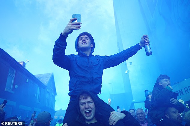 Toffees supporters threw flares to support the side as the team bus pulled into Goodison Road