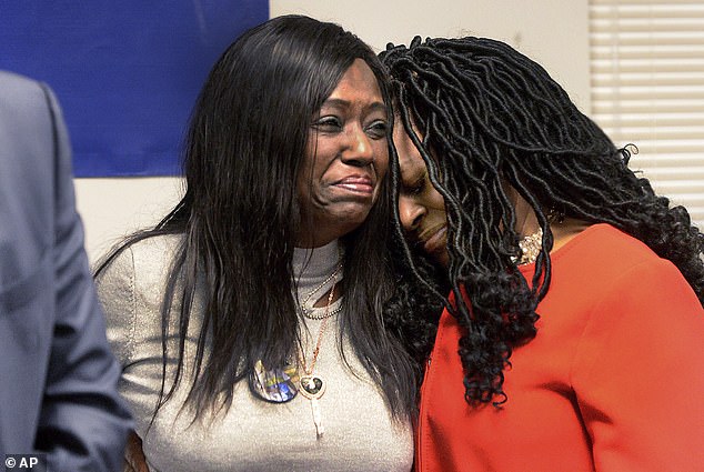 Moore's grieving mother, Rosena Washington (pictured left), told a news conference Thursday that she wants Cadigan and Finley to be held accountable for her son's death.