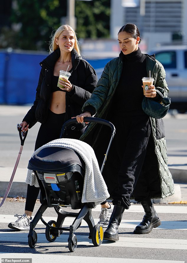 Stylish: The former Victoria's Secret model looked comfortable in a black turtleneck sweater and sweatpants tucked into a pair of chunky tall boots