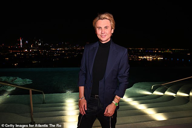 Ready to swim?  Cheban, also known as Foodgod, wore a dark blazer as he posed poolside.