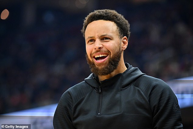 Stephen Curry #30 of the Golden State Warriors reacts off the sidelines during the first half against the Cleveland Cavaliers at Rocket Mortgage Fieldhouse on Friday