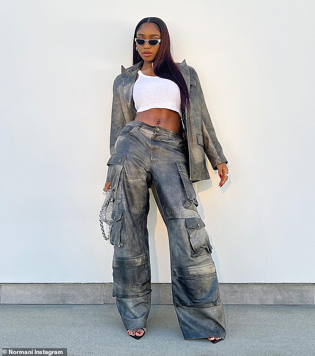 Killer pants: The Dancing with a Stranger singer's metallic gray cargo pants featured multiple pockets and a low waist