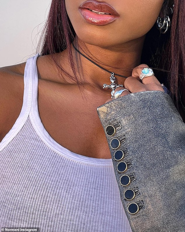 Tasteful Jewelry: Normani's glamor was impeccable and she adorned herself in silver jewelry, with a silver cross around her neck as the focal point.